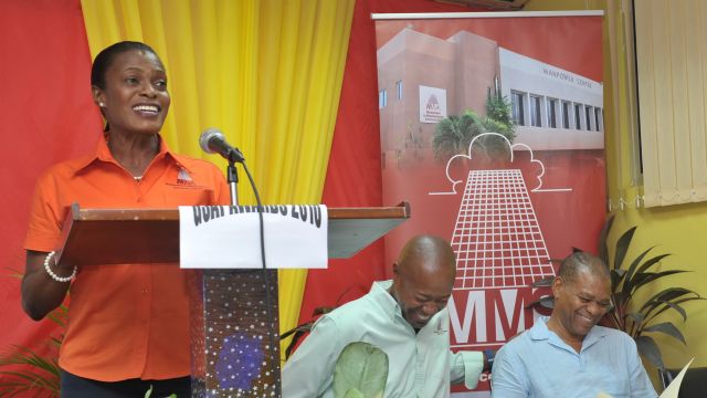 MMS’ Human Resource Manager, Monica Young (at lectern) adds humour to her presentation at the GSAT Awards function, to the delight of (l-r) Deputy CEO of MMS Garth Hinchcliffe and theatre personality and motivational speaker, Pablo Hoilett.