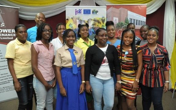 Deputy CEO of Manpower, Garth Hinchcliffe (back row, far left), Human Resource Director Monica Young (back row, far right) and Clerk in the HR department Shari Reid (front row, far right), take time out for a photograph with a group of summer workers and Jamaica Social Investment Fund (JSIF) Interns who gained valuable work experience at Manpower in 2018.